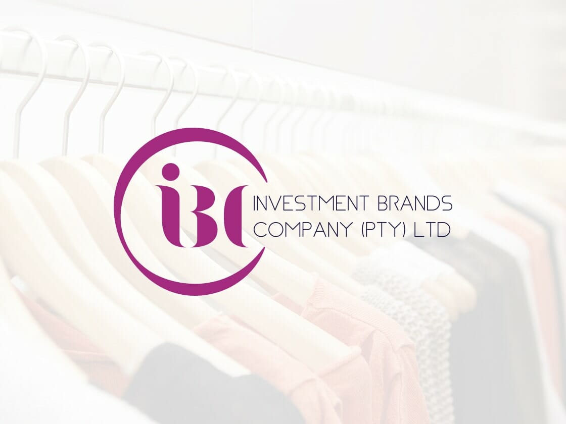Portfolio-logo-IBC Clothes on hangers are in the background with a blurred effect. In the foreground, a purple and white logo reads "IBC" within a circular design. Next to the logo, text in purple reads "INVESTMENT BRANDS COMPANY (PTY) LTD.