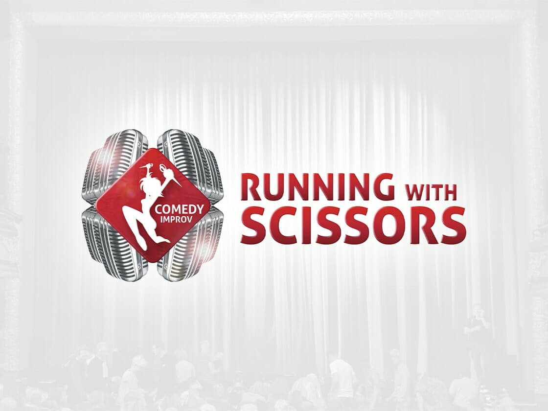 Portfolio-logo-running-with-scissors A red diamond-shaped logo with a white silhouette of a person holding scissors and the text "COMEDY IMPROV" is on the left. Surrounding this are four microphone graphics. To the right, bold red text reads "RUNNING WITH SCISSORS." The background features a blurred image of people in a theater setting.